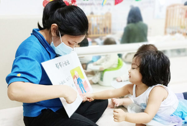 Star Learners_Blog Piece_Main Image_teacher teaching an infant
